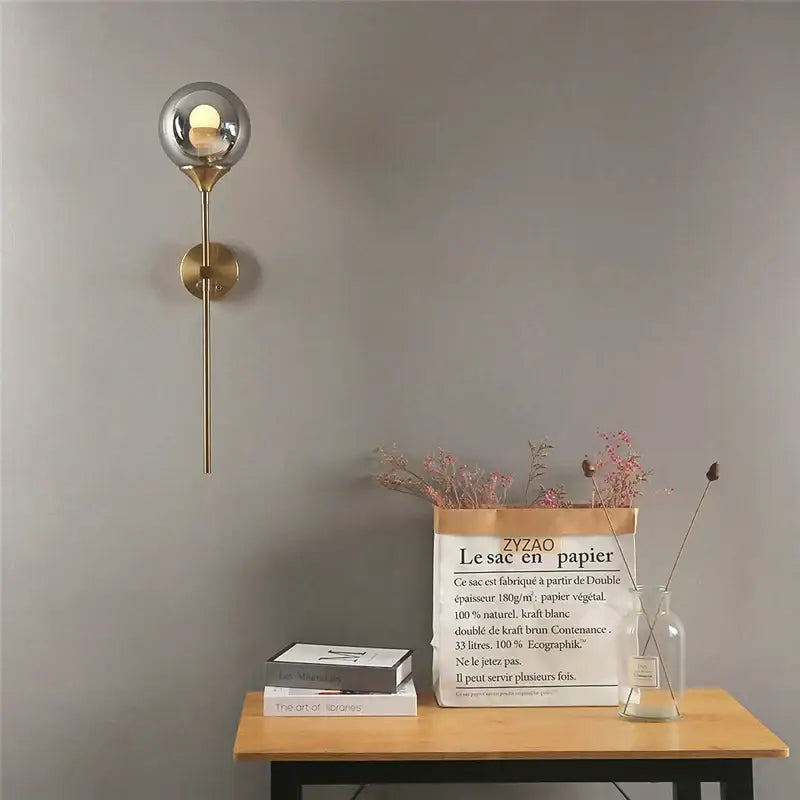A sleek brass sphere glass ball led wall light by decorbites golden glass for modern bedroom decor