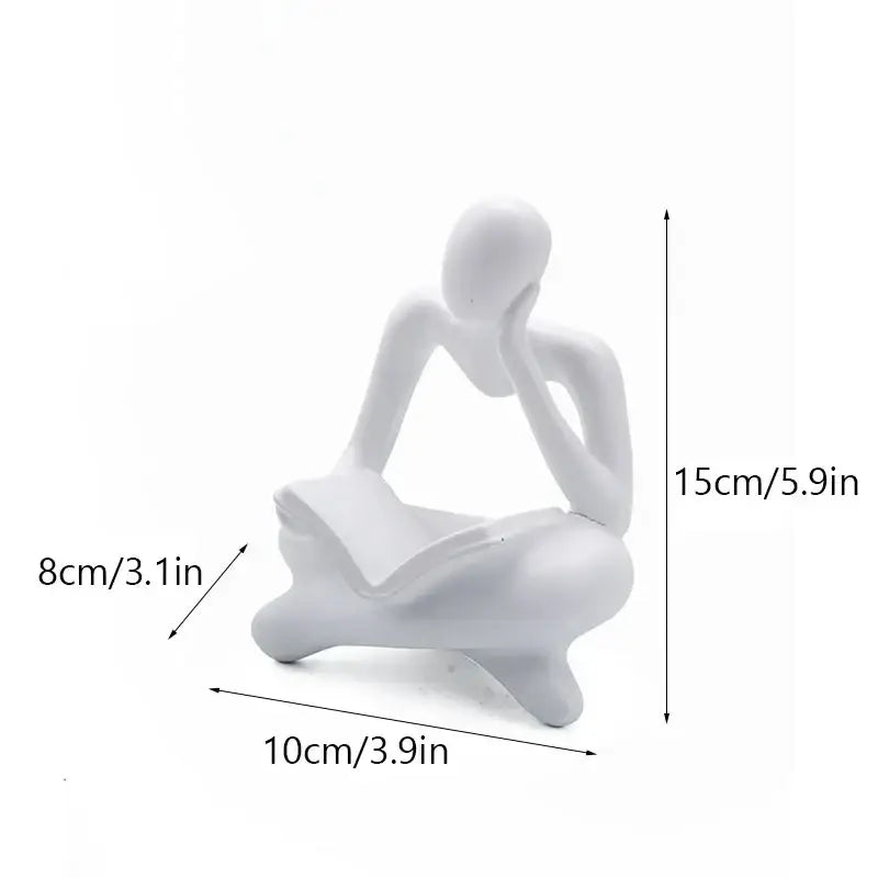 White resin figurine of a seated abstract thinker holding an open book decorbites abstract thinker resin office decor