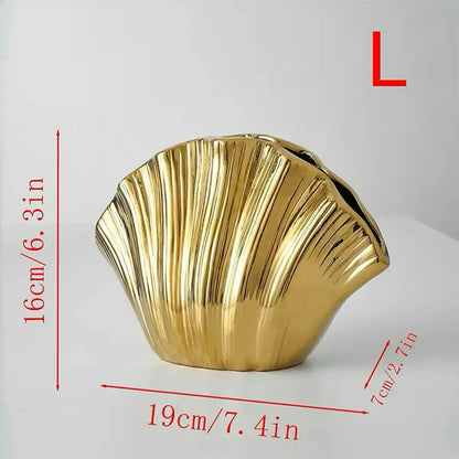 Golden glossy gradient shell ceramic vase shaped like a scallop shell with vertical ridges for living room decor