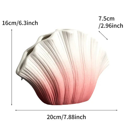 A ceramic gradient shell vase in glossy white to soft pink finish for living room decor by decorbites gradient shell