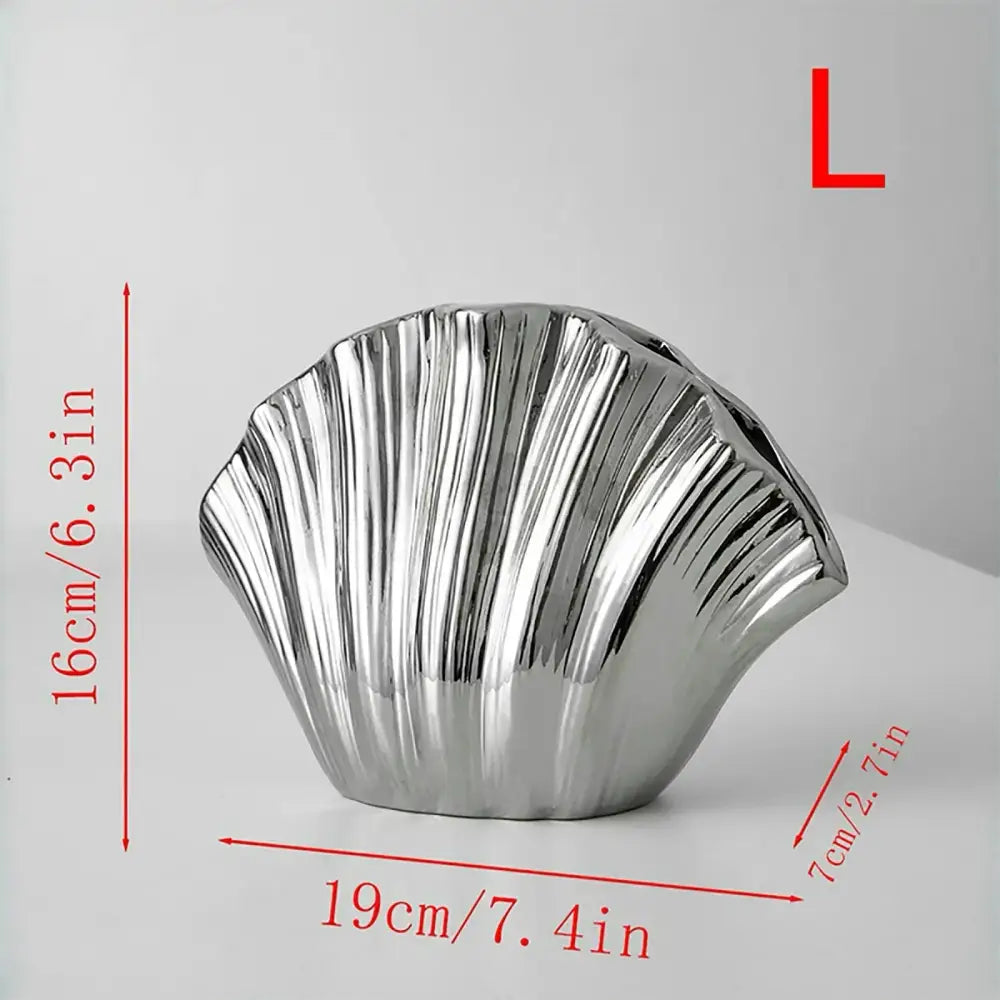 Shiny silver seashell-shaped gradient shell ceramic vase for living room decor by decorbites