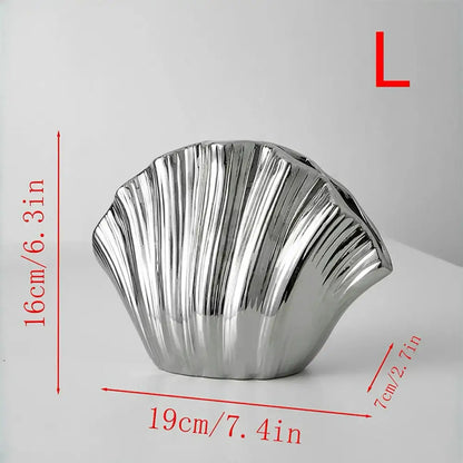 Shiny silver seashell-shaped gradient shell ceramic vase for living room decor by decorbites