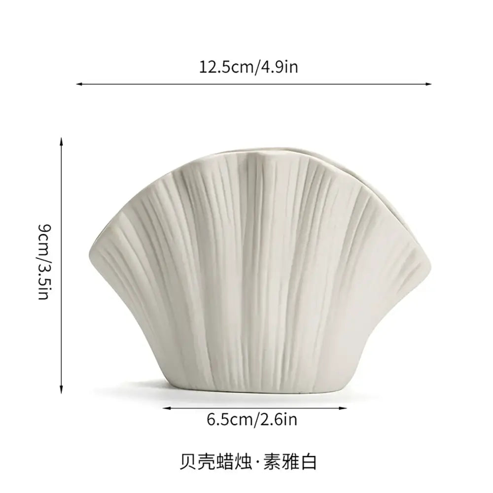 A sleek matte ivory fan-shaped gradient shell ceramic candle holder with vertical ridges for decorbites gradient shell decor