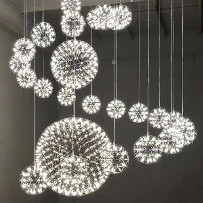 A modern golden gypsophila sparkball pendant chandelier with bright white led lights in geometric web pattern
