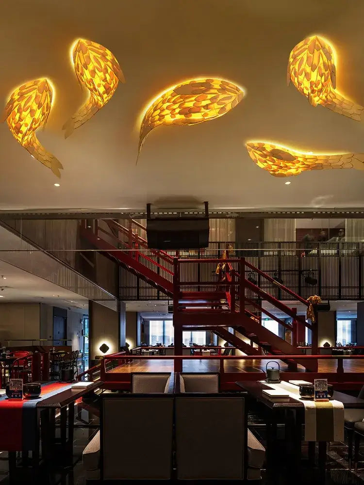 Golden handwoven bamboo led fish wall light with woven texture illuminates restaurant decorbites handwoven bamboo space