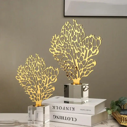 Golden hollow tree coral sculpture with intricate cut-out patterns on clear acrylic bases for living room decor