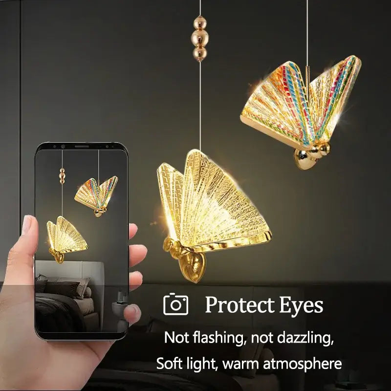 Golden iridescent butterfly pendant light with rainbow wings and metallic gold body for living room decor by decorbites butterfly pendant