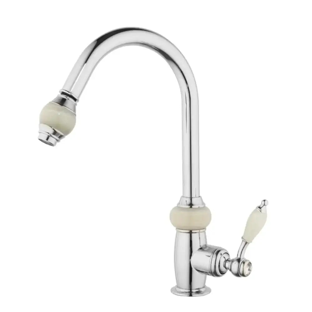 Chrome finished kitchen faucet with cream ceramic handles and spout accents featuring golden jade diamond handle design