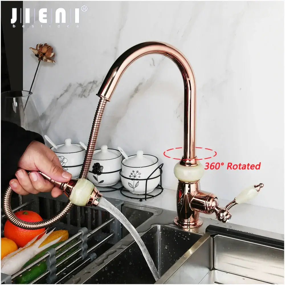 Rose gold kitchen faucet with golden jade diamond handle, flexible gooseneck spout, white ceramic handles, and swivel pull