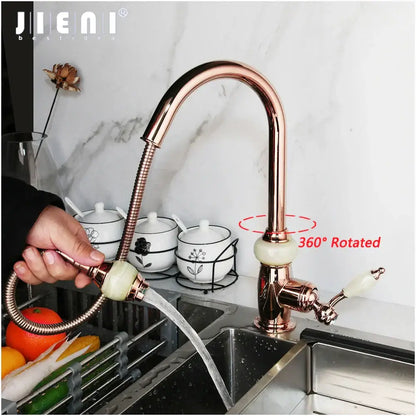 Rose gold kitchen faucet with golden jade diamond handle, flexible gooseneck spout, white ceramic handles, and swivel pull