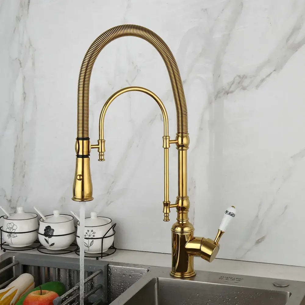 Golden kitchen faucet with white ceramic handle, flexible gooseneck, and pull-down spray head by decorbites golden kitchen