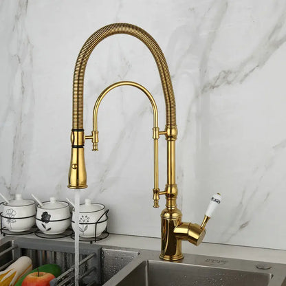 Golden kitchen faucet with white ceramic handle, flexible gooseneck, and pull-down spray head by decorbites golden kitchen