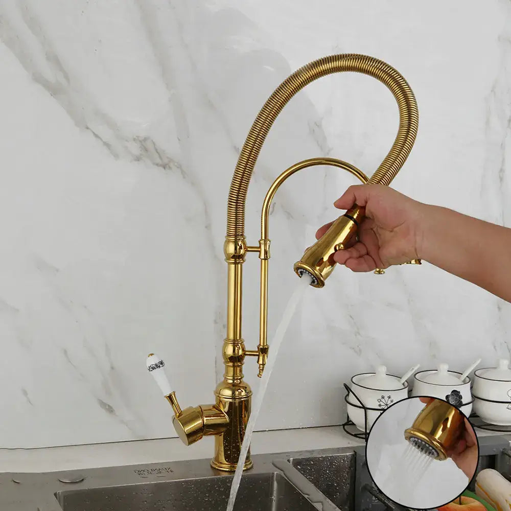 Golden kitchen faucet with white ceramic handle and flexible gooseneck pull-out spray head from decorbites