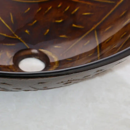 Brown glass vessel sink set with gold leaf patterns and black rim perfect for decorbites golden leaf bathroom decor