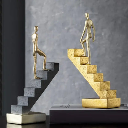 Golden man abstract resin staircase sculpture with golden and silver figures for living room decorbites decor