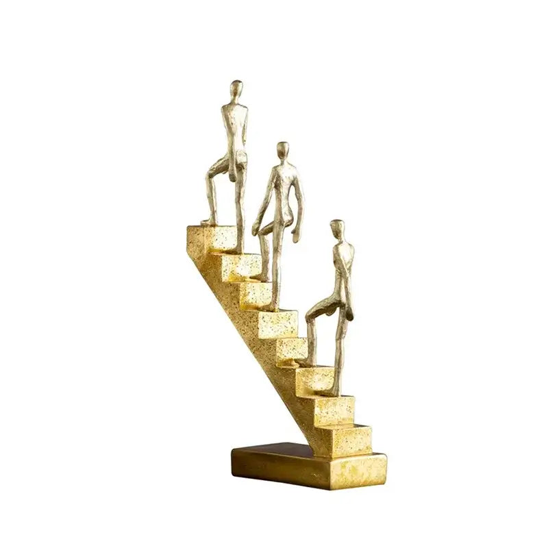 Golden man abstract resin staircase sculpture featuring three golden metallic figures ascending textured steps for decorbites decor