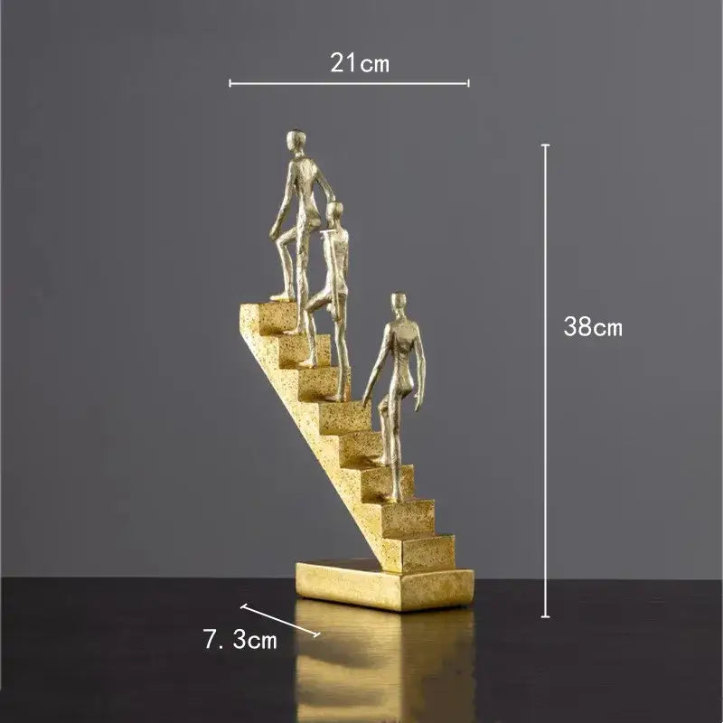 Golden man abstract resin sculpture in metallic gold depicting three figures ascending a staircase for living room decorbites decor