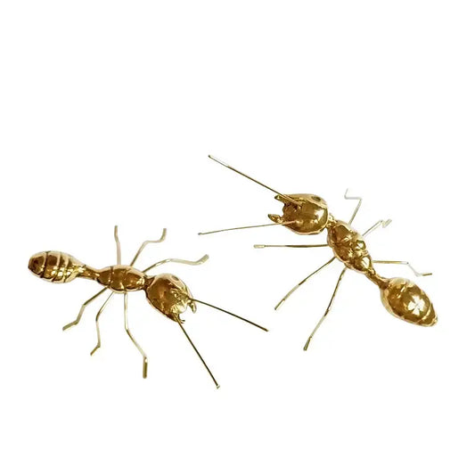Golden metal ants decorative figurines with detailed segmented bodies and articulated legs for home decor use