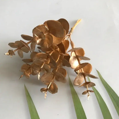 Golden metallic eucalyptus branch with circular leaves and slender stems for decorbites green plant berry stamen decor