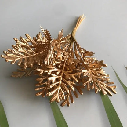 Golden metallic fern brooch with intricate leaf detailing featuring berry stamen green plant decorbites design for decor