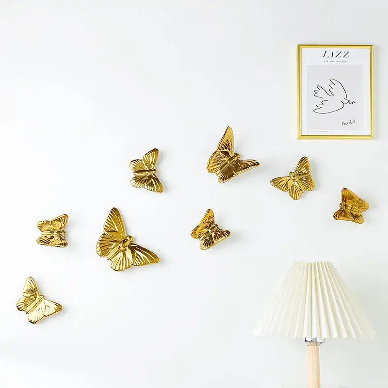 Golden metallic ceramic butterfly wall decoration set for living room featuring elegant wall decoration pieces