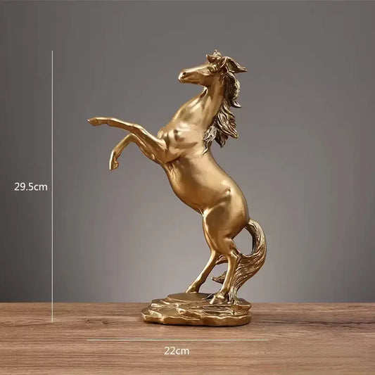 Golden metallic horse resin sculpture with detailed mane and tail on rocky base for living room decorbites horse decor
