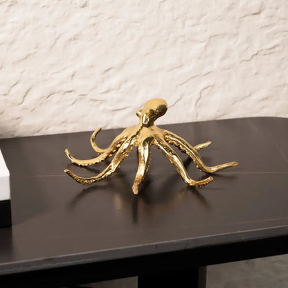 Golden octopus metal sculpture with detailed tentacles and polished reflective surface for living room decorbites decor