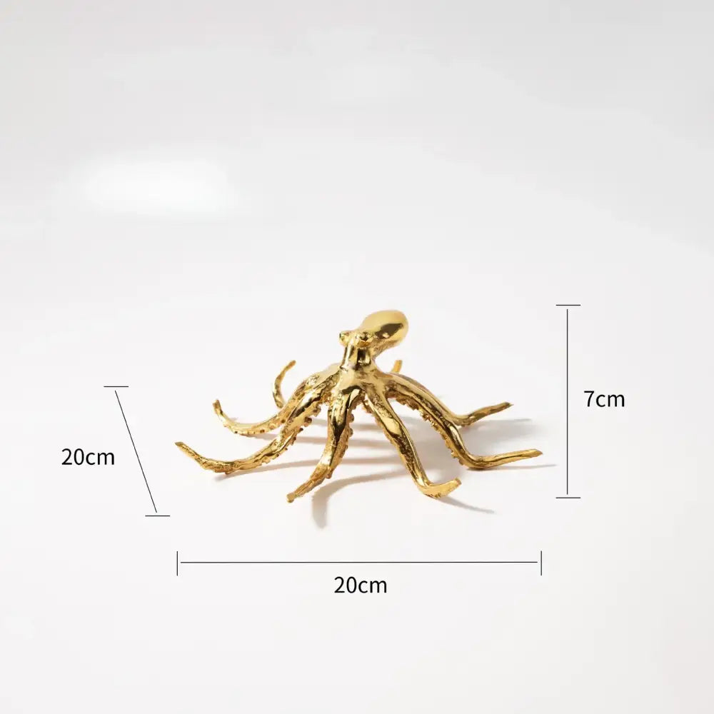Golden octopus metal sculpture with detailed textured arms and polished finish decorbites golden octopus figurine