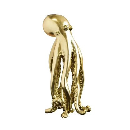 Golden metallic octopus sculpture candle holder with detailed suction cups and polished surface for dining room decorbites decor