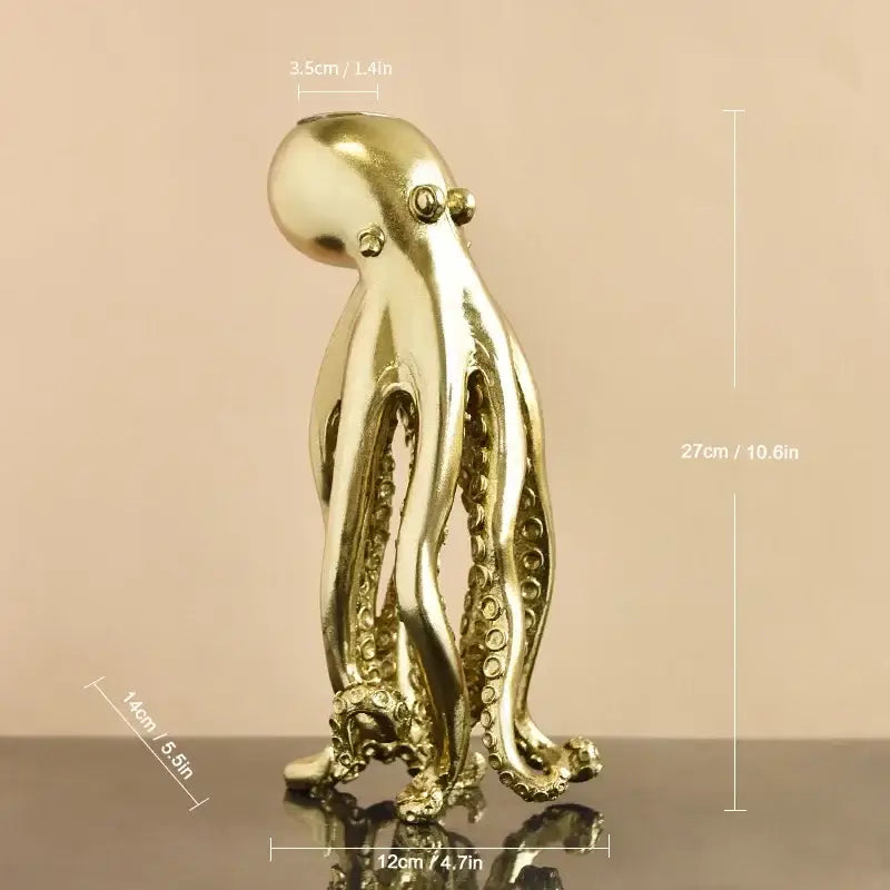 Golden metallic octopus sculpture candle holder with detailed suction cups and polished reflective surface for decorbites decor
