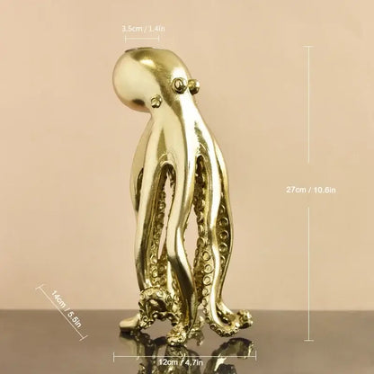 Golden metallic octopus sculpture candle holder with detailed suction cups and polished reflective surface for decorbites decor