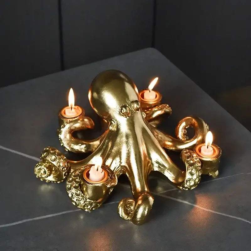 Golden octopus sculpture candle holder with textured metallic finish and five lit candles for dining room decorbites decor