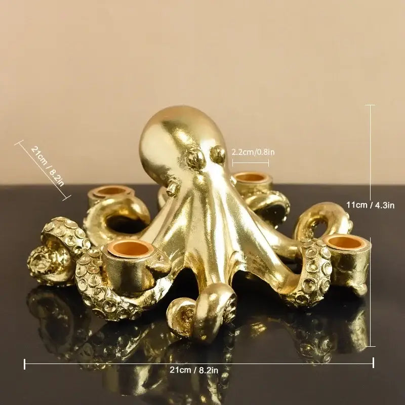 Golden octopus sculpture candle holder with textured tentacles and circular cup holders for dining room decor by decorbites