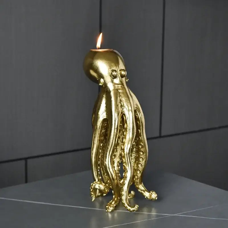 Golden octopus sculpture candle holder with lit flame for dining room decor by decorbites golden octopus