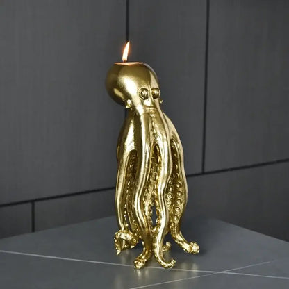Golden octopus sculpture candle holder with lit flame for dining room decor by decorbites golden octopus