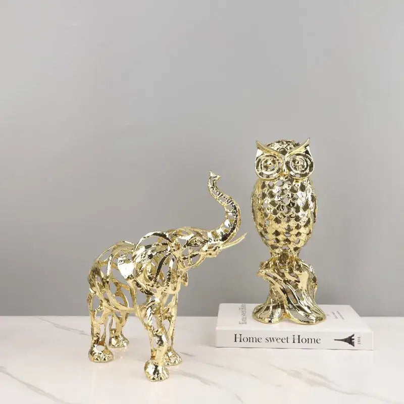 Golden openwork animal sculpture of an intricately detailed owl figurine with faceted texture on a decorative base decorbites golden openwork