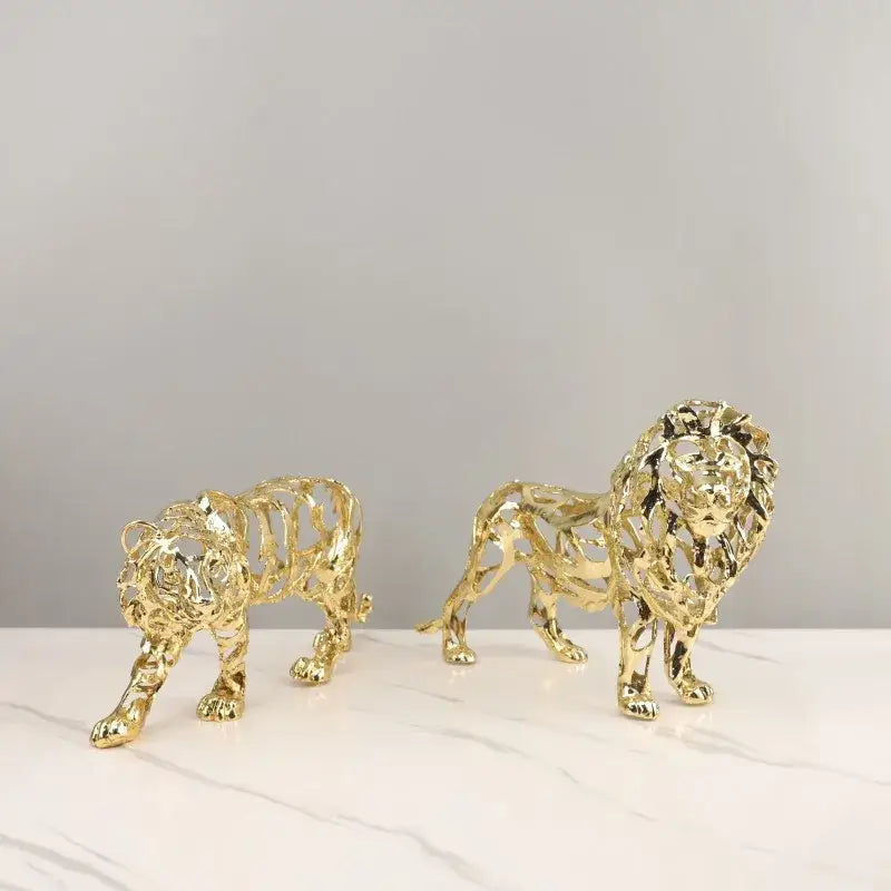 Golden openwork animal sculpture featuring intricate lion and tiger figurines ideal for living room decorbites decor