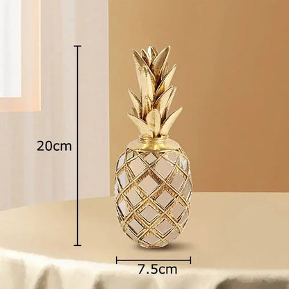 Golden pineapple art statuette with lattice design and metallic finish ideal as a stylish desk decoration