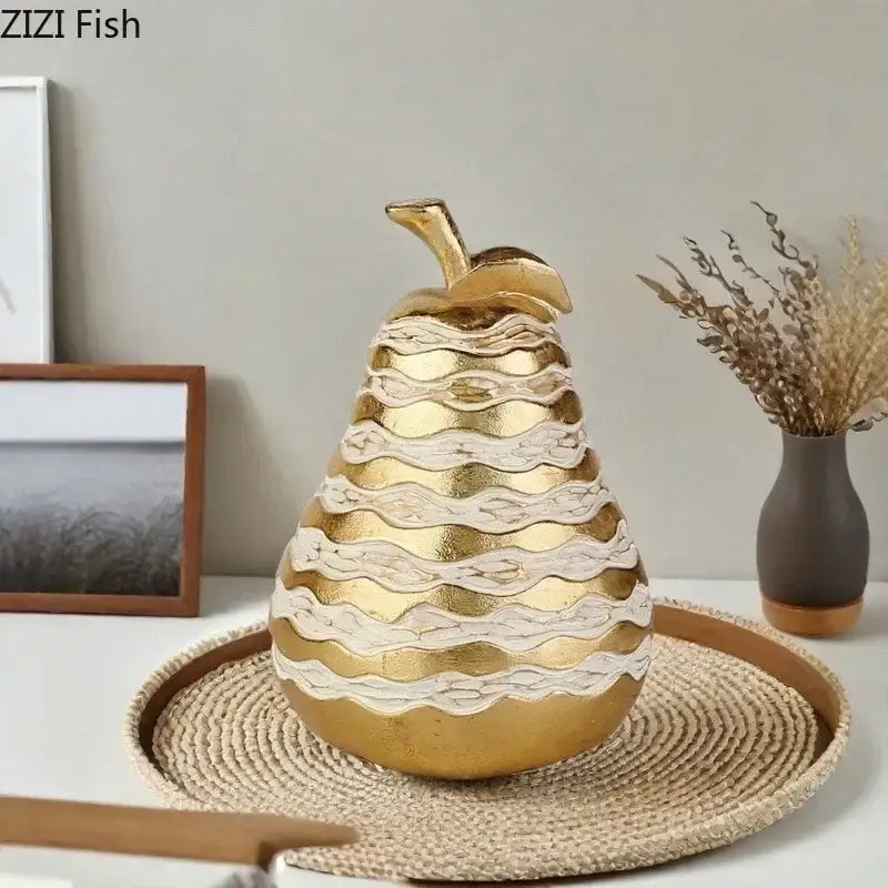 Golden pineapple art statuette with layered white and gold textured bands for elegant desk decoration