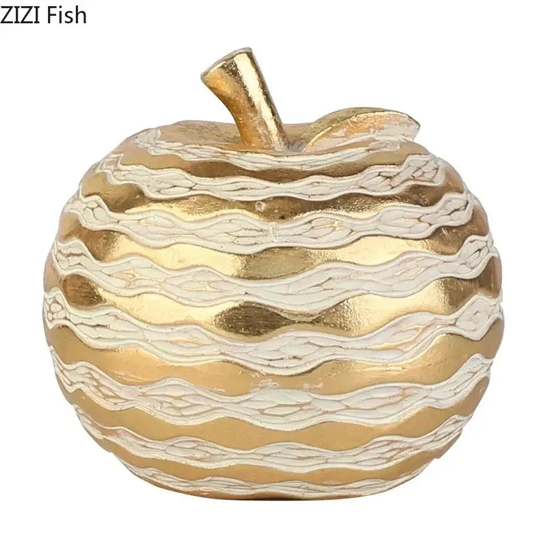 Gold and cream striped apple-shaped art statuette with metallic finish for desk decoration and golden pineapple theme