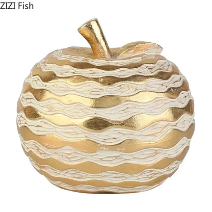 Gold and cream striped apple-shaped art statuette with metallic finish for desk decoration and golden pineapple theme