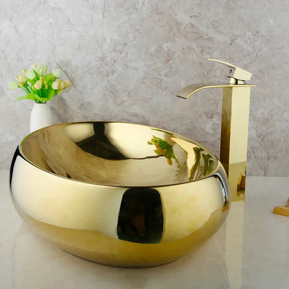 Golden plated ceramic basin sink and matching tall faucet in shiny gold for decorbites golden plated bathroom set