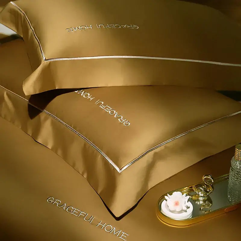 Gold satin egyptian cotton pillowcases from decorbites 1000tc bedding set with silver embroidery and piping detail