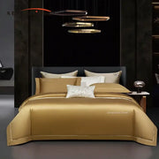Golden satin egyptian cotton bedding set with subtle embroidered detailing and matching pillowcases by decorbites 1000tc egyptian