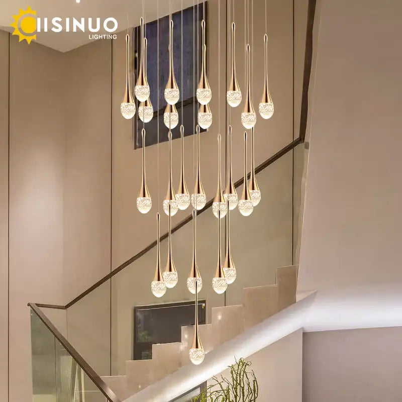 Golden teardrop crystal staircase chandelier with crystal accents from decorbites decorbites crystal staircase lighting