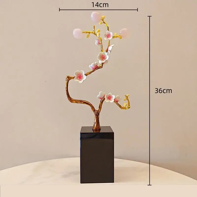 Delicate golden tree metal decor figurine with pink and white blossoms on black rectangular base for living room