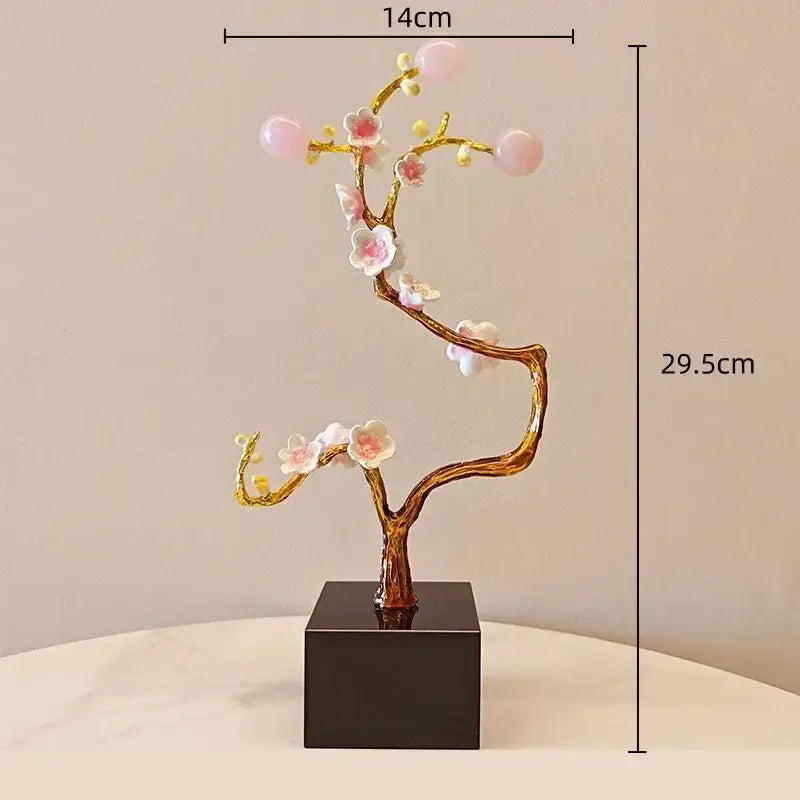 Golden tree metal decor figurine featuring pink and white resin flowers and translucent gemstone buds on black base