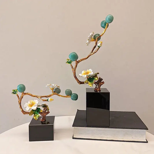 Elegant golden tree plum blossom porcelain sculpture with gold-toned branches, turquoise ornaments, and white blossoms