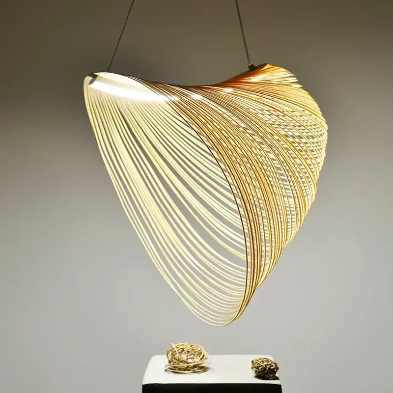 Golden wire mesh bamboo pendant light chandelier with flowing shell-like design made of thin interwoven metallic rods for decorbites bamboo pendant decor