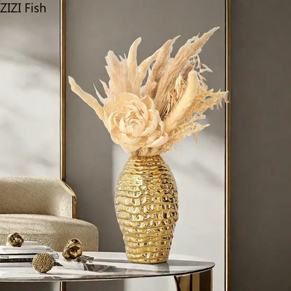 Golden wrinkle ceramic vase with textured gold finish holding dried beige pampas grass and cream artificial rose decorbites golden wrinkle